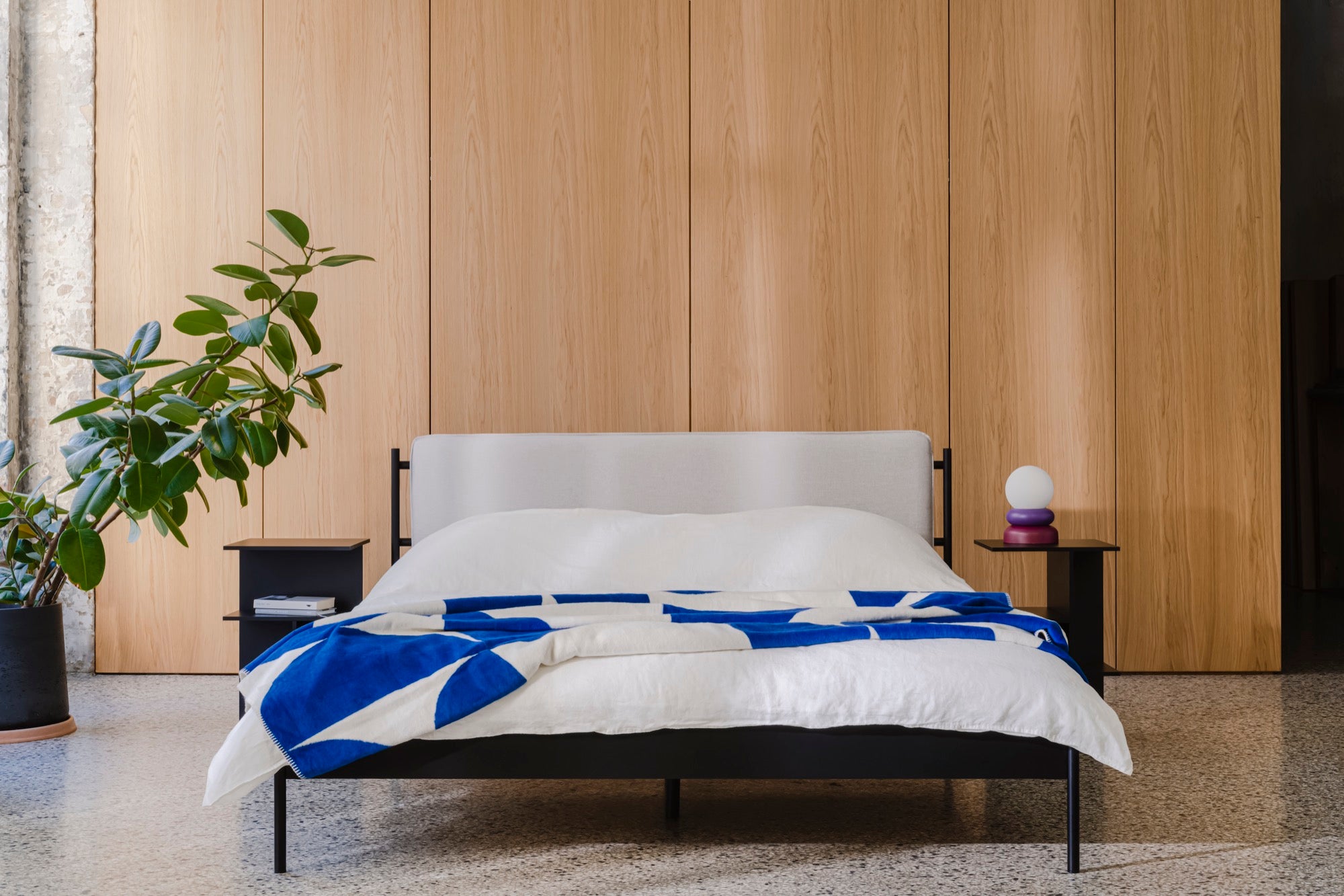 bedroom beds beige indoor spring-ideas black blue lamps nightstands throws violet 