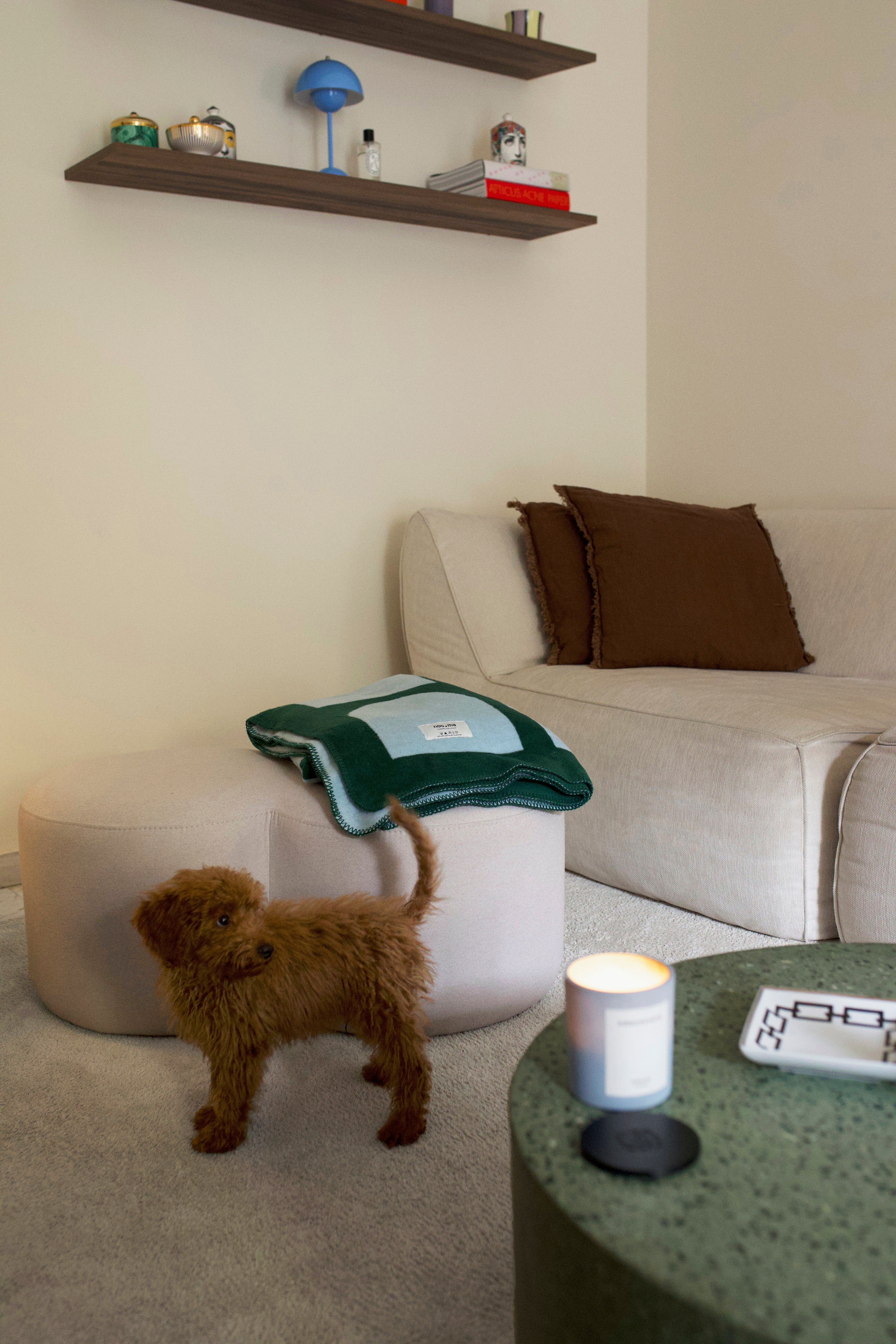 green indoor living-room poufs beige throws 