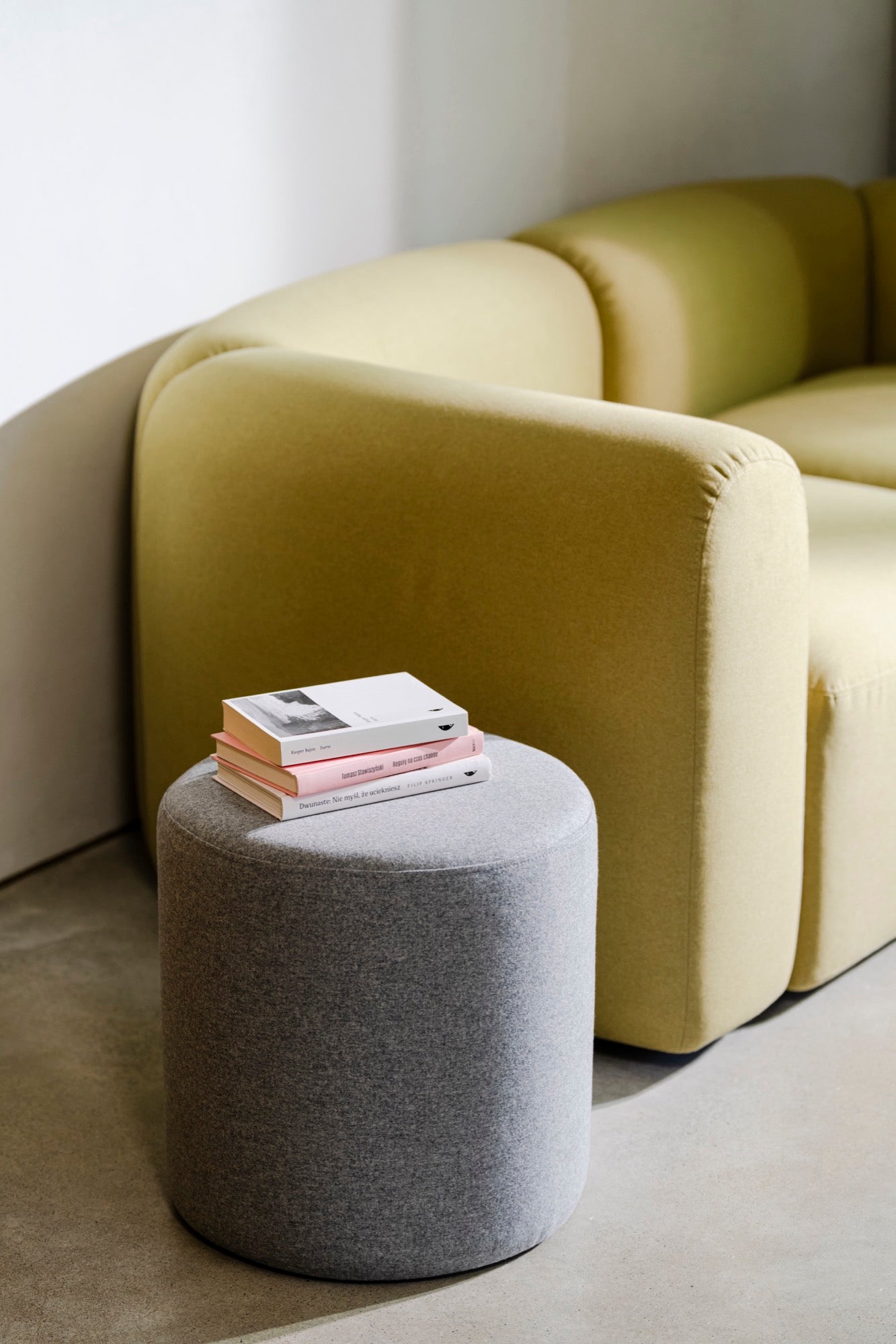 indoor light-grey living-room sofas poufs side-tables yellow 