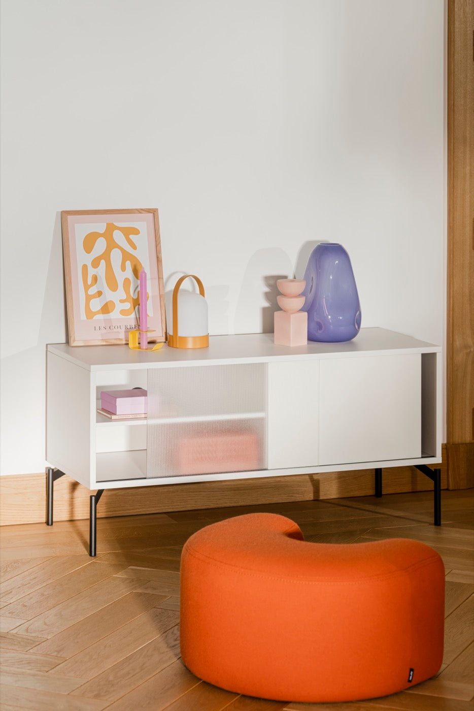 beige indoor living-room summer-interior tv-stands candle-holders orange poufs terracotta yellow 