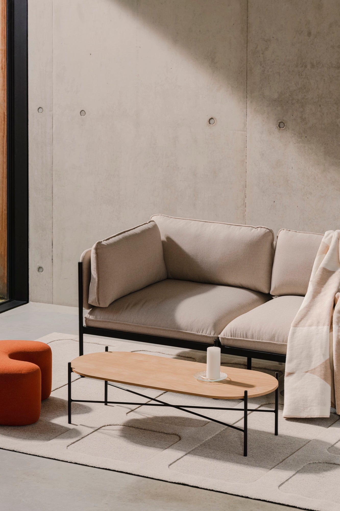 beige indoor living-room seatings black coffee-tables light-grey oak orange poufs rugs sofas terracotta throws 