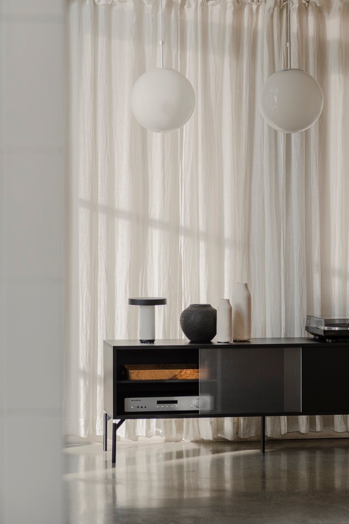 black indoor living-room summer-interior tv-stands lamps 