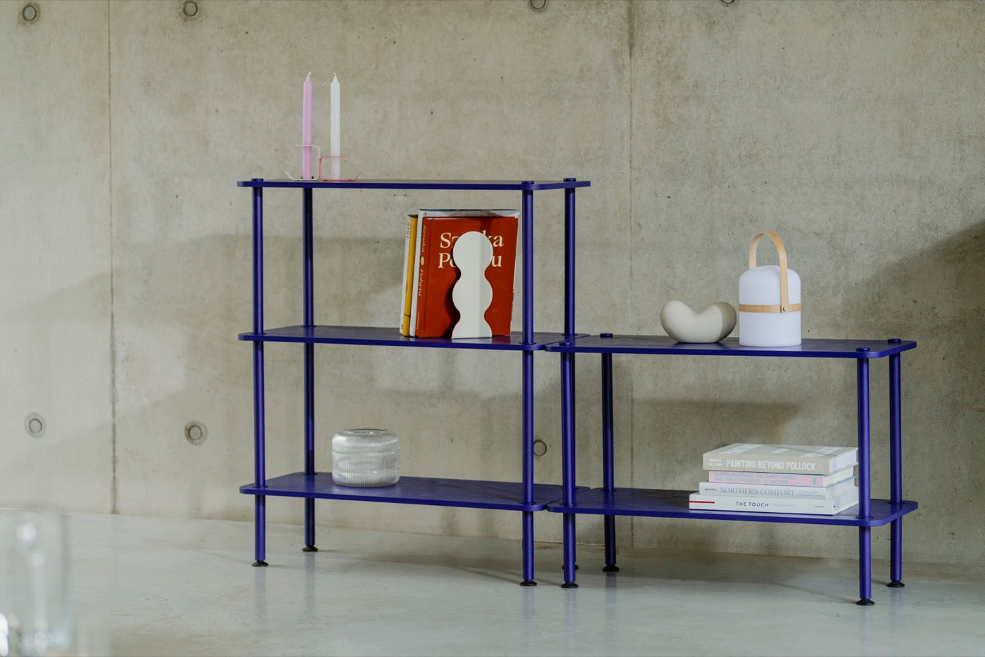 blue indoor living-room shelving-units beige bookends candle-holders candles home-office 